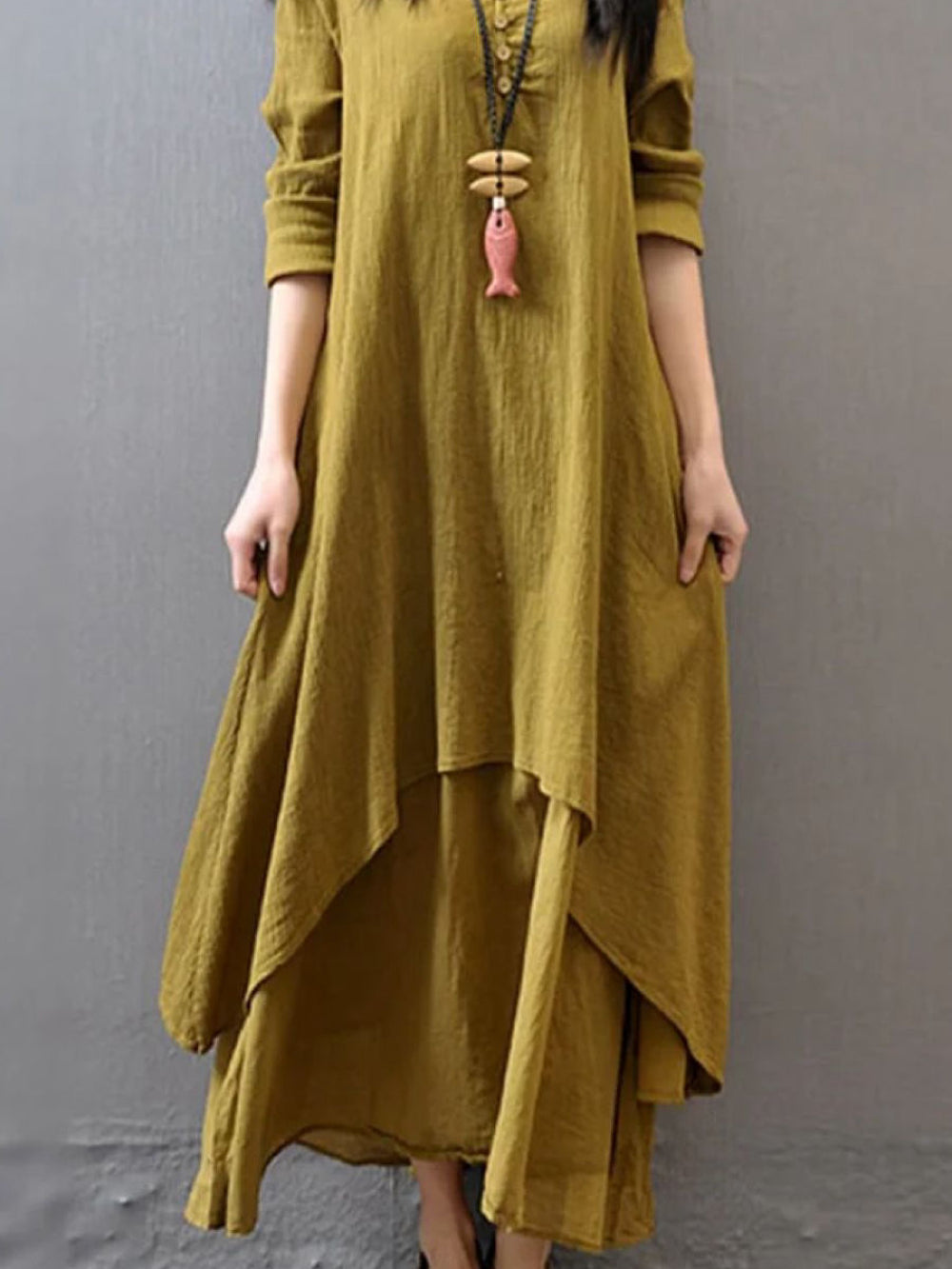 Mustard pure cotton double-layer dress. It comes with a long slip below the ankle and an asymmetric overlay dress on top. It has two pockets