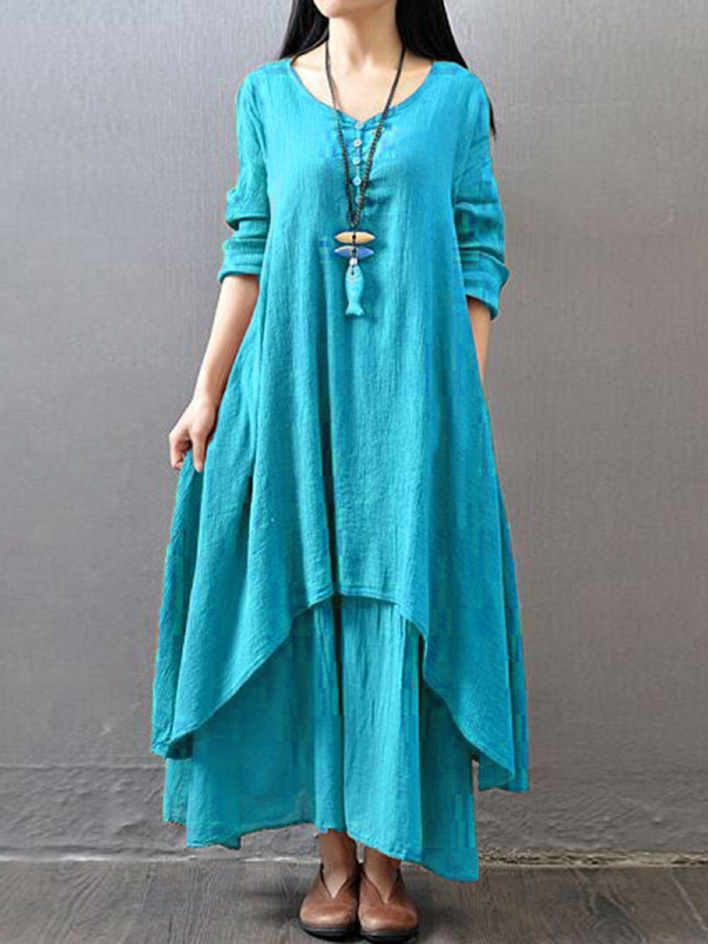 Turquoise pure cotton double-layer dress. It comes with a long slip below the ankle and an asymmetric overlay dress on top. It has two pockets