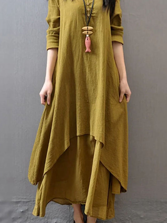 Mustard pure cotton double-layer dress. It comes with a long slip below the ankle and an asymmetric overlay dress on top. It has two pockets