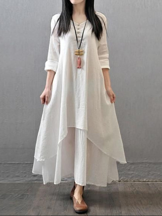 White pure cotton double-layer dress. It comes with a long slip below the ankle and an asymmetric overlay dress on top. It has two pockets