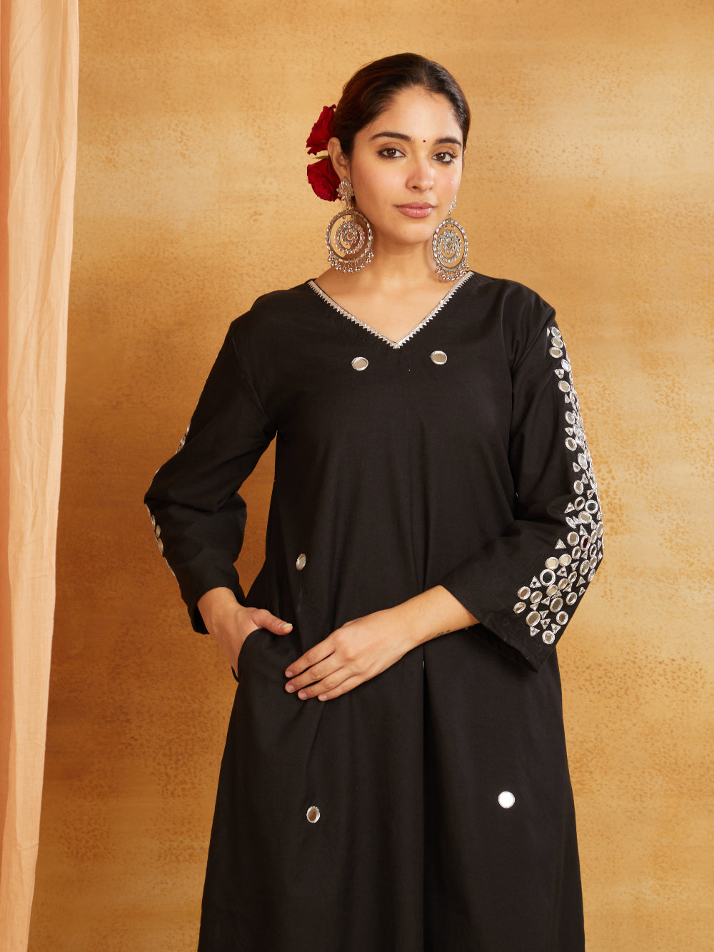 Black kurta, pant, and dupatta with mirror work