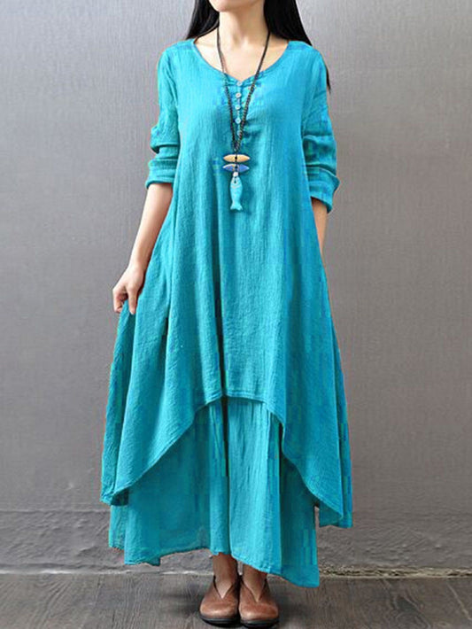 Turquoise pure cotton double-layer dress. It comes with a long slip below the ankle and an asymmetric overlay dress on top. It has two pockets