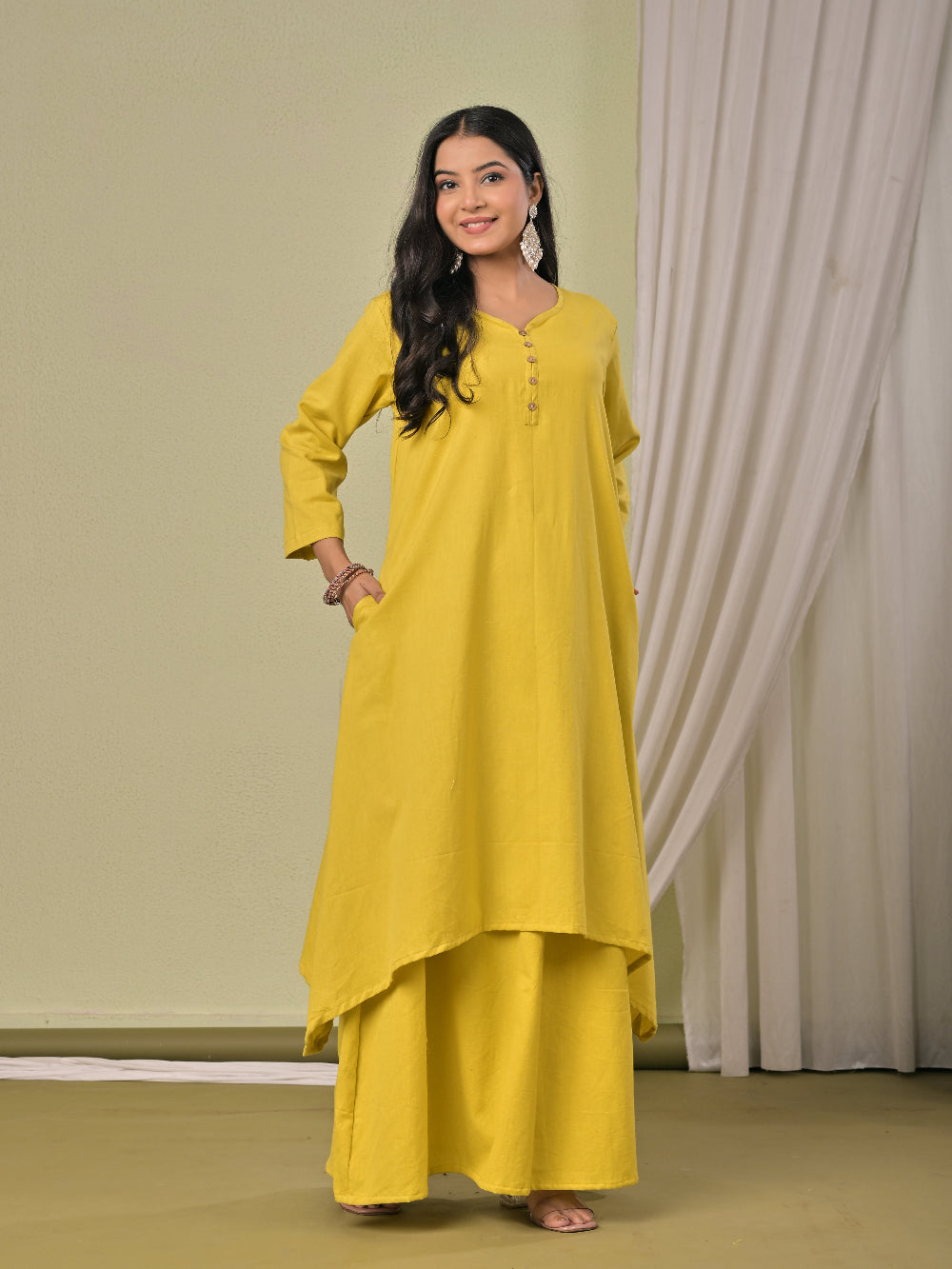 Pale Yellow  pure cotton double-layer dress. It comes with a long skirt below the ankle and an asymmetric overlay dress on top. It has two pockets