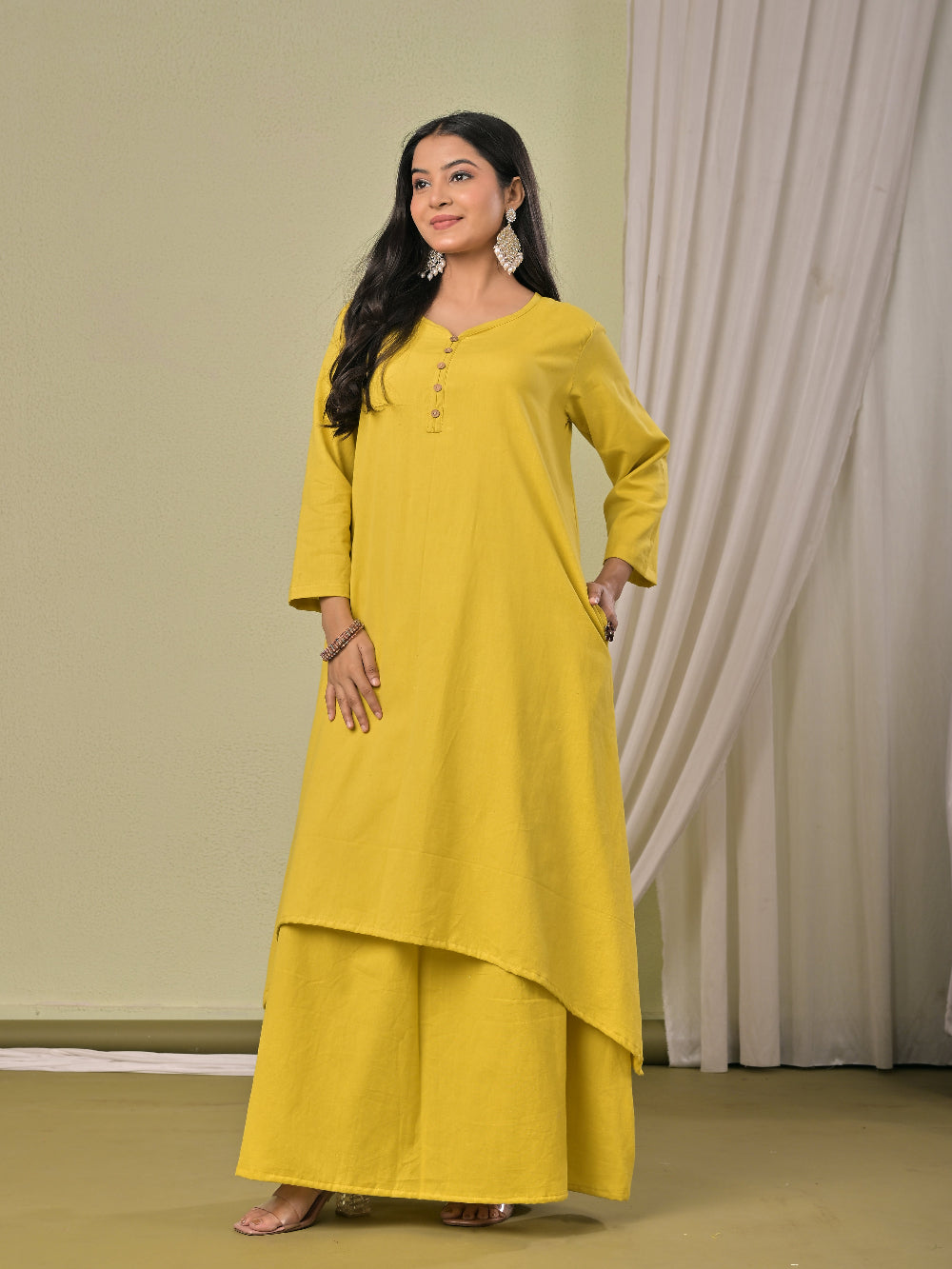 Pale Yellow  pure cotton double-layer dress. It comes with a long skirt below the ankle and an asymmetric overlay dress on top. It has two pockets