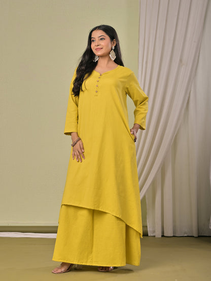 Pale Yellow  pure cotton double-layer dress. It comes with a long skirt below the ankle and an asymmetric overlay dress on top. It has two pockets