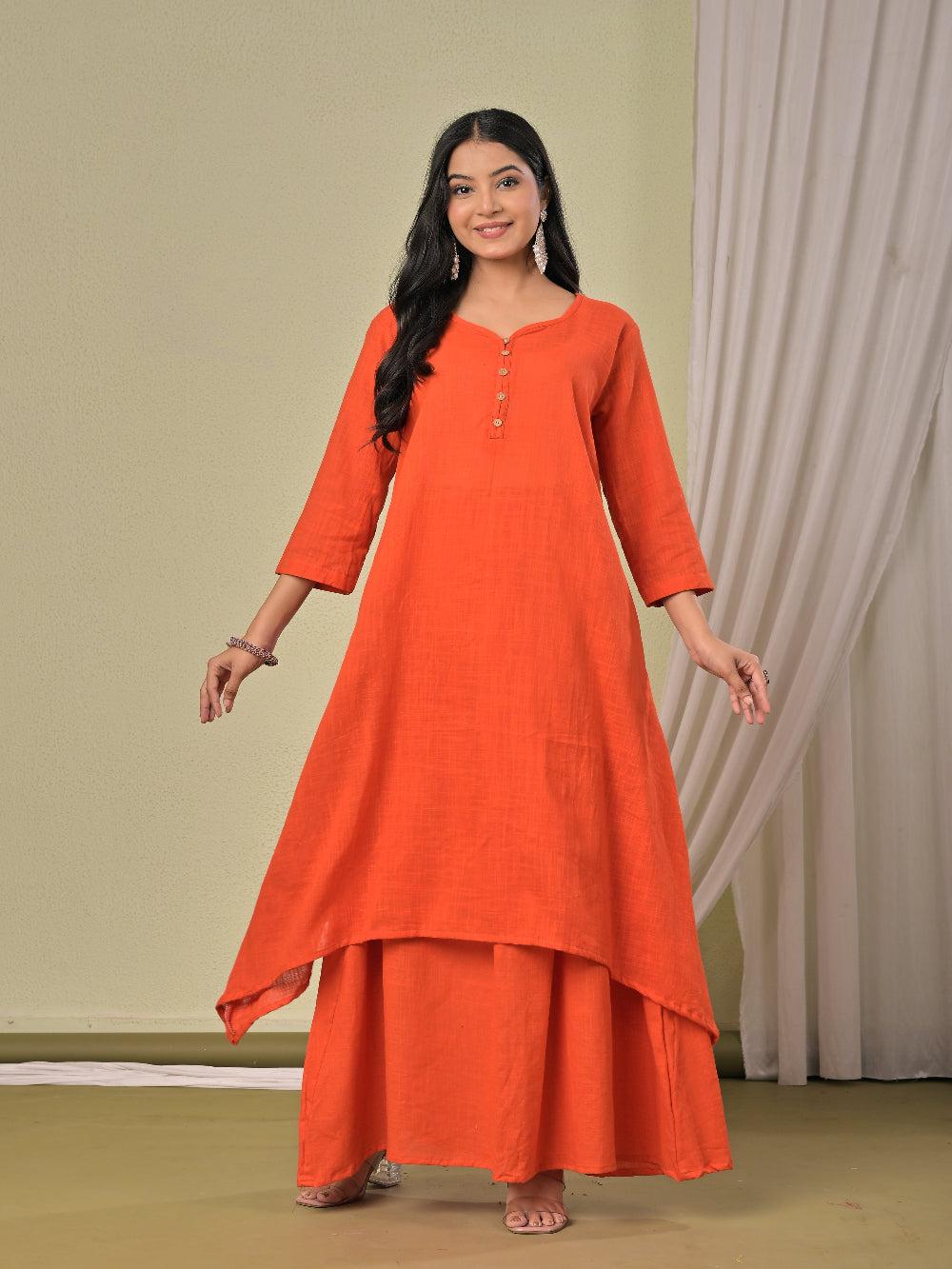 Dull Orange pure cotton double-layer dress. It comes with a long skirt below the ankle and an asymmetric overlay dress on top. It has two pockets